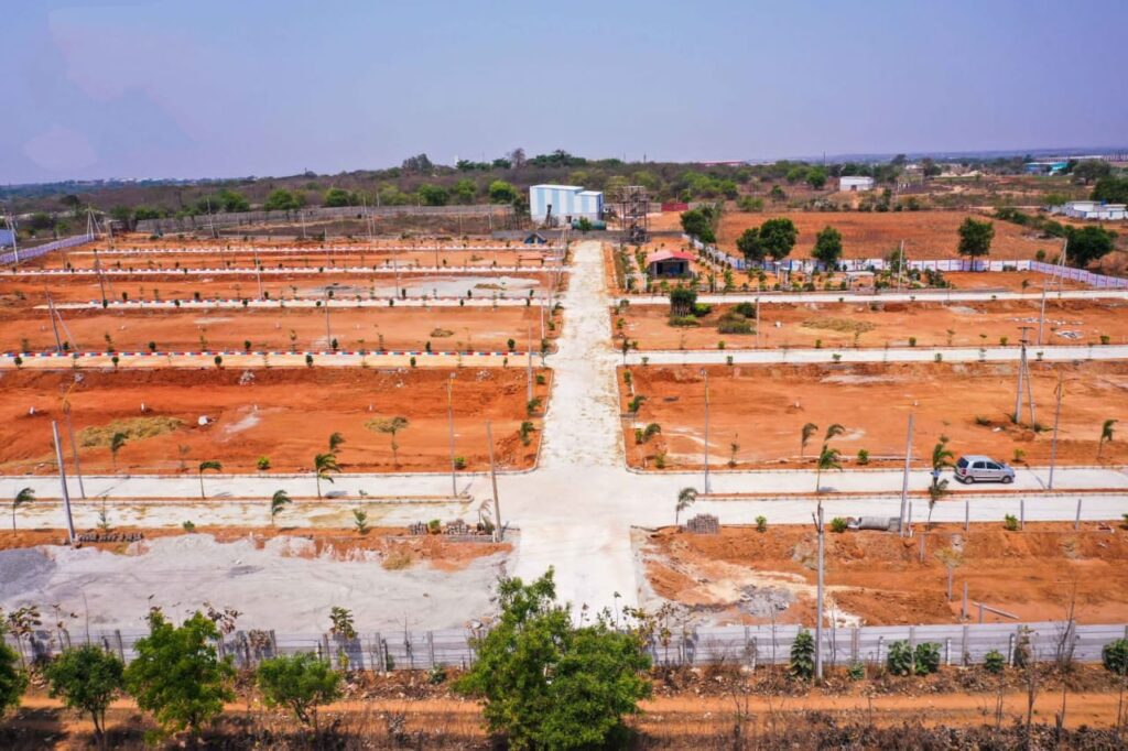 Elegant staircase with glass railing and ambient lighting in modern duplex villa